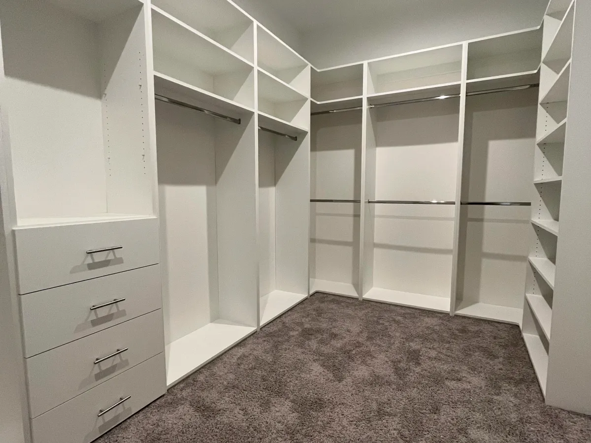 Luxury master closet system with island and LED lighting in Estero, FL