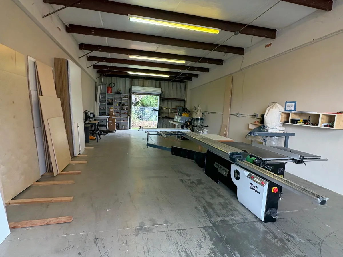 Garage storage system with wall-mounted cabinets and workbench in Naples, FL