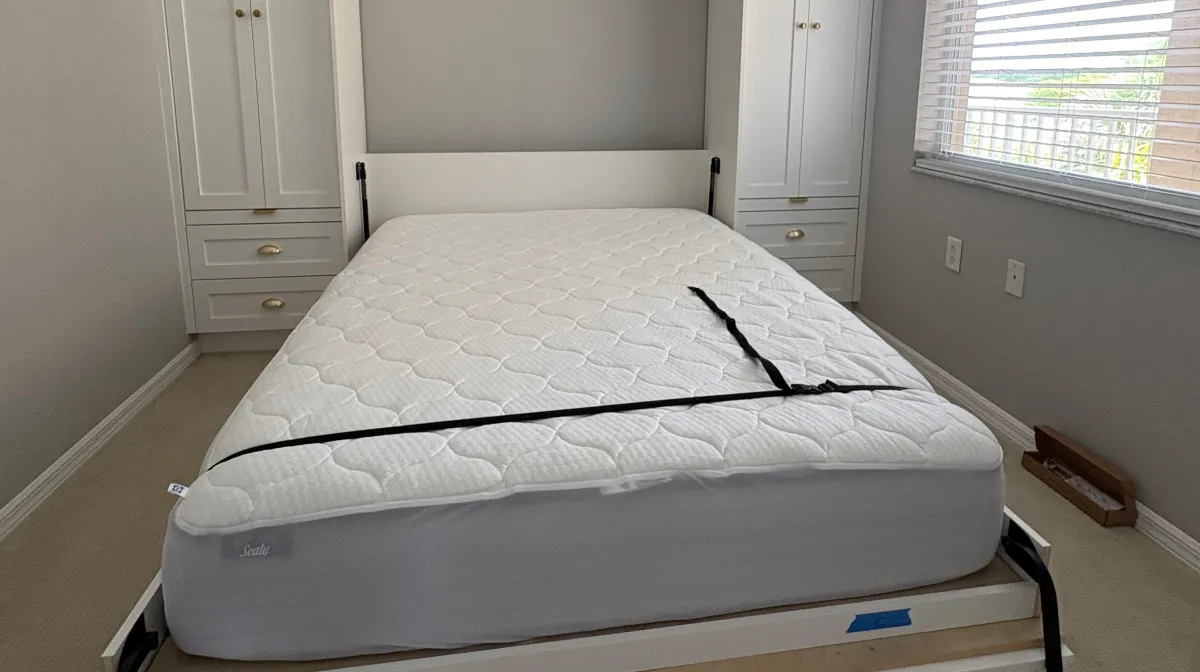 EG Custom Cabinets Custom murphy bed with built-in shelving by EG Contractors in Naples, FL