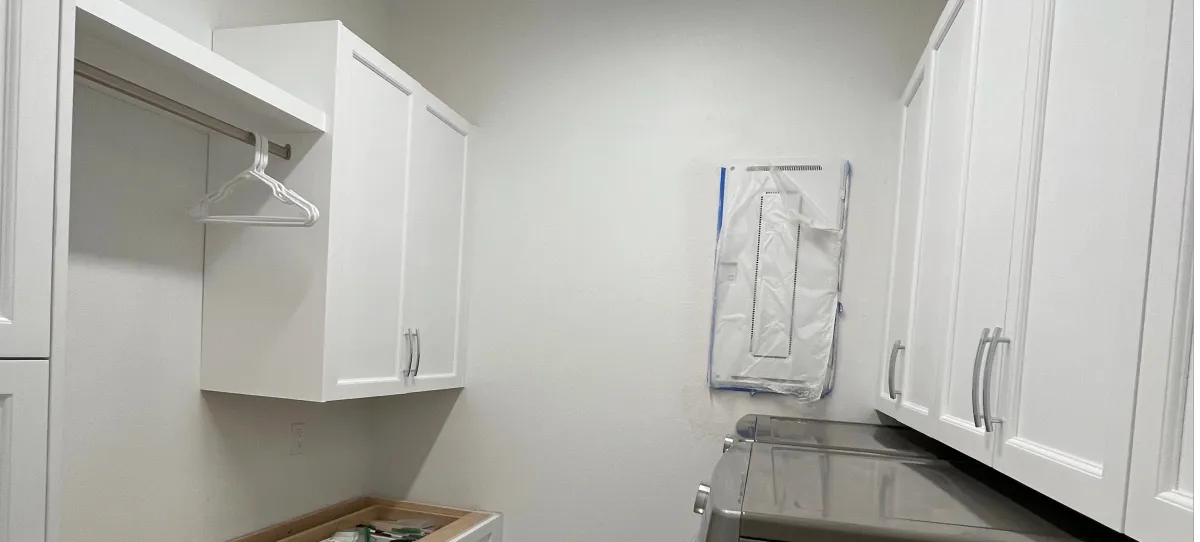 Custom reach-in closet with organized shelving by EG Contractors in Naples, FL