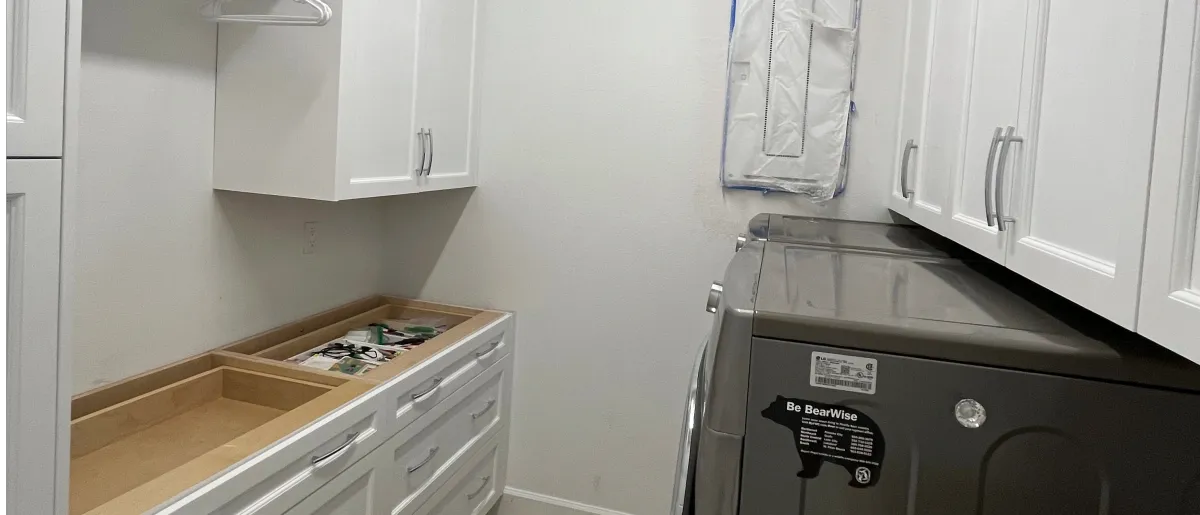 Custom kitchen pantry with pull-out shelves by EG Contractors in Naples, FL