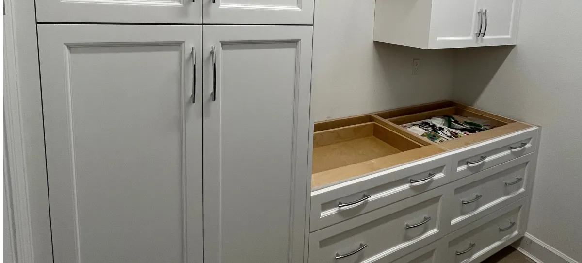 EG Custom Cabinets Custom kids closet with adjustable rods and shelving by EG Contractors in Naples, FL
